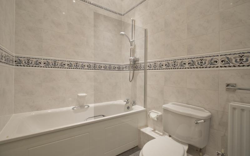 Two bathrooms at 8 Chapman House in Harrogate